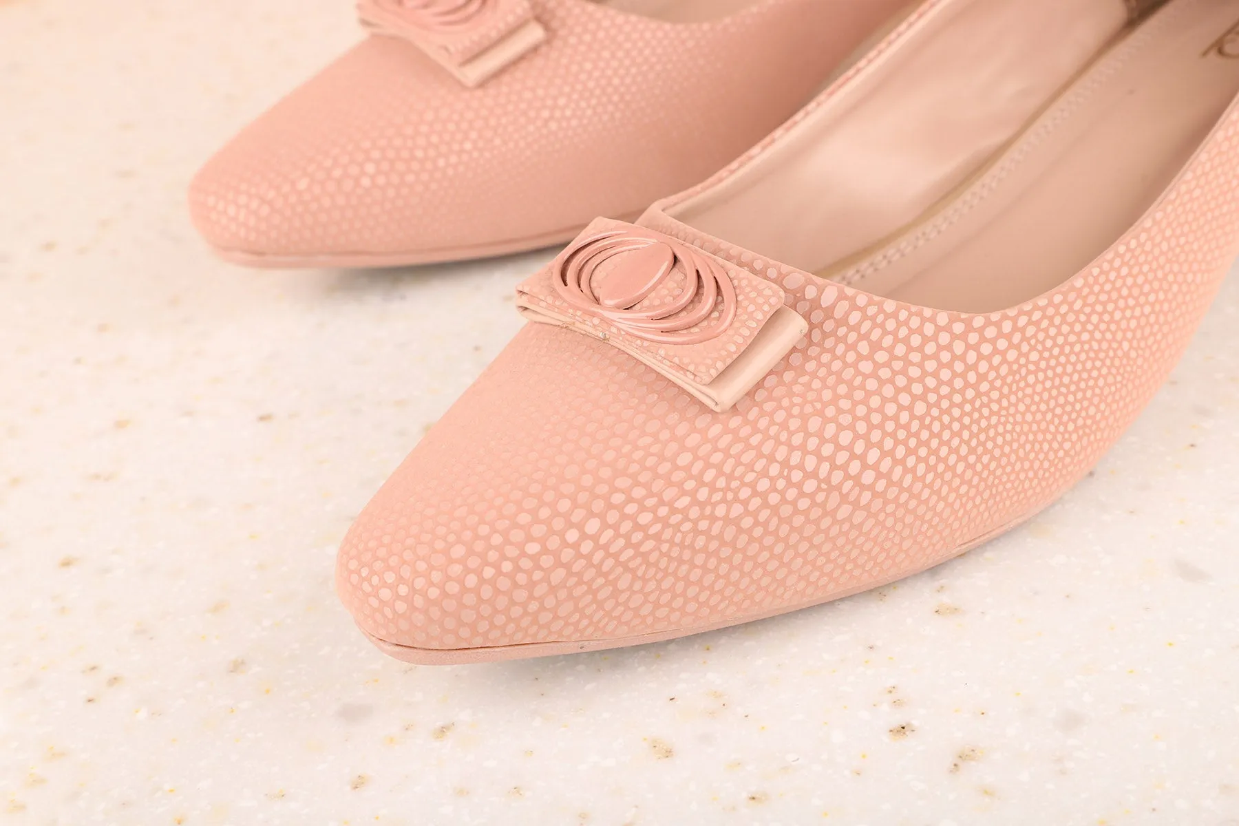 Women Pink Textured Pumps with Bows